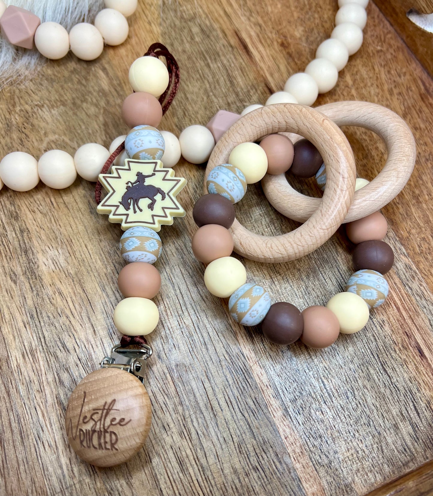 Cream bronc pacifier clip + teether ring