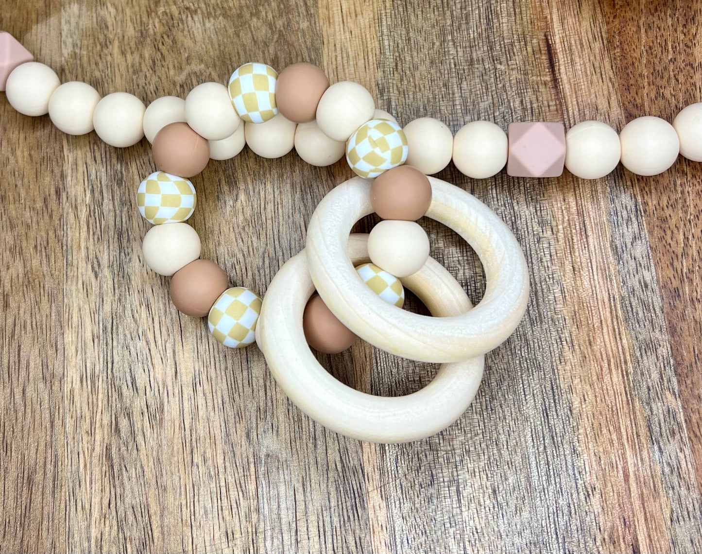 Tan checkers teether ring
