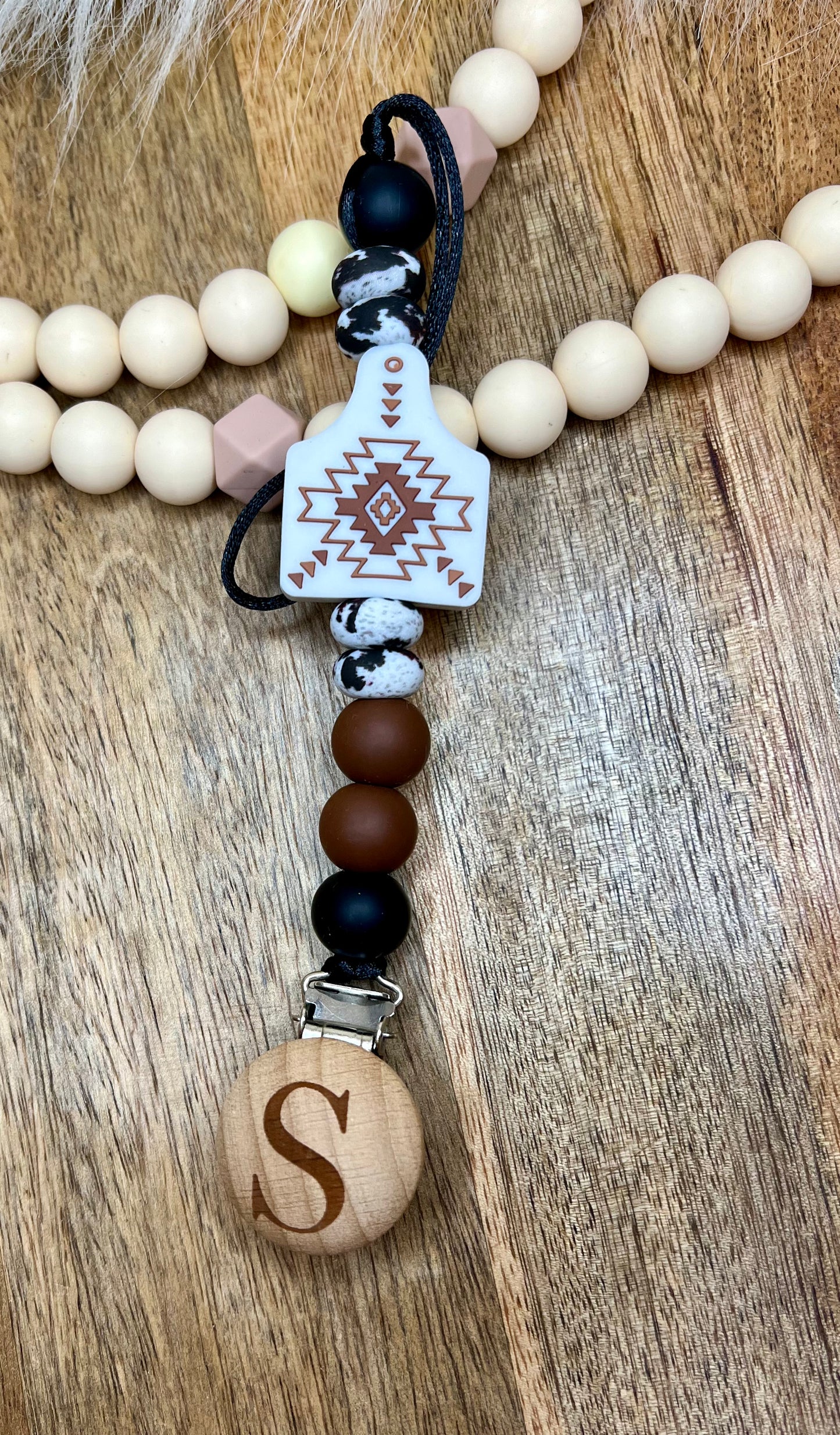 White Aztec cowtag cowhide pacifier clip