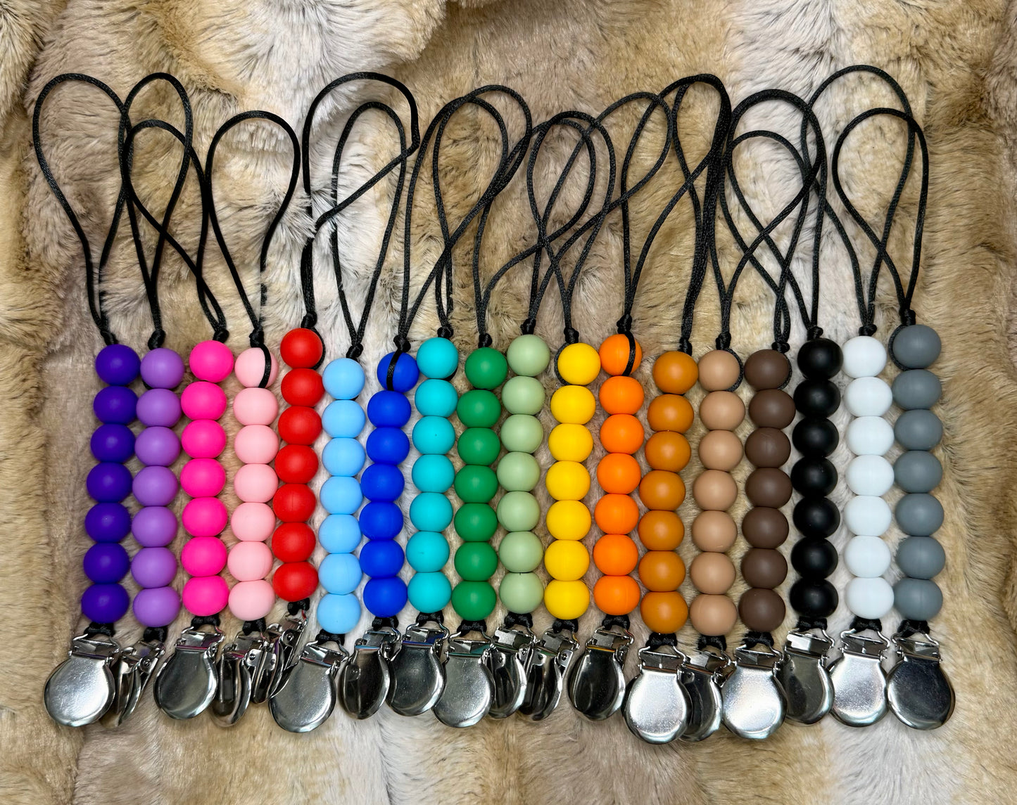 Solid colored pacifier clips