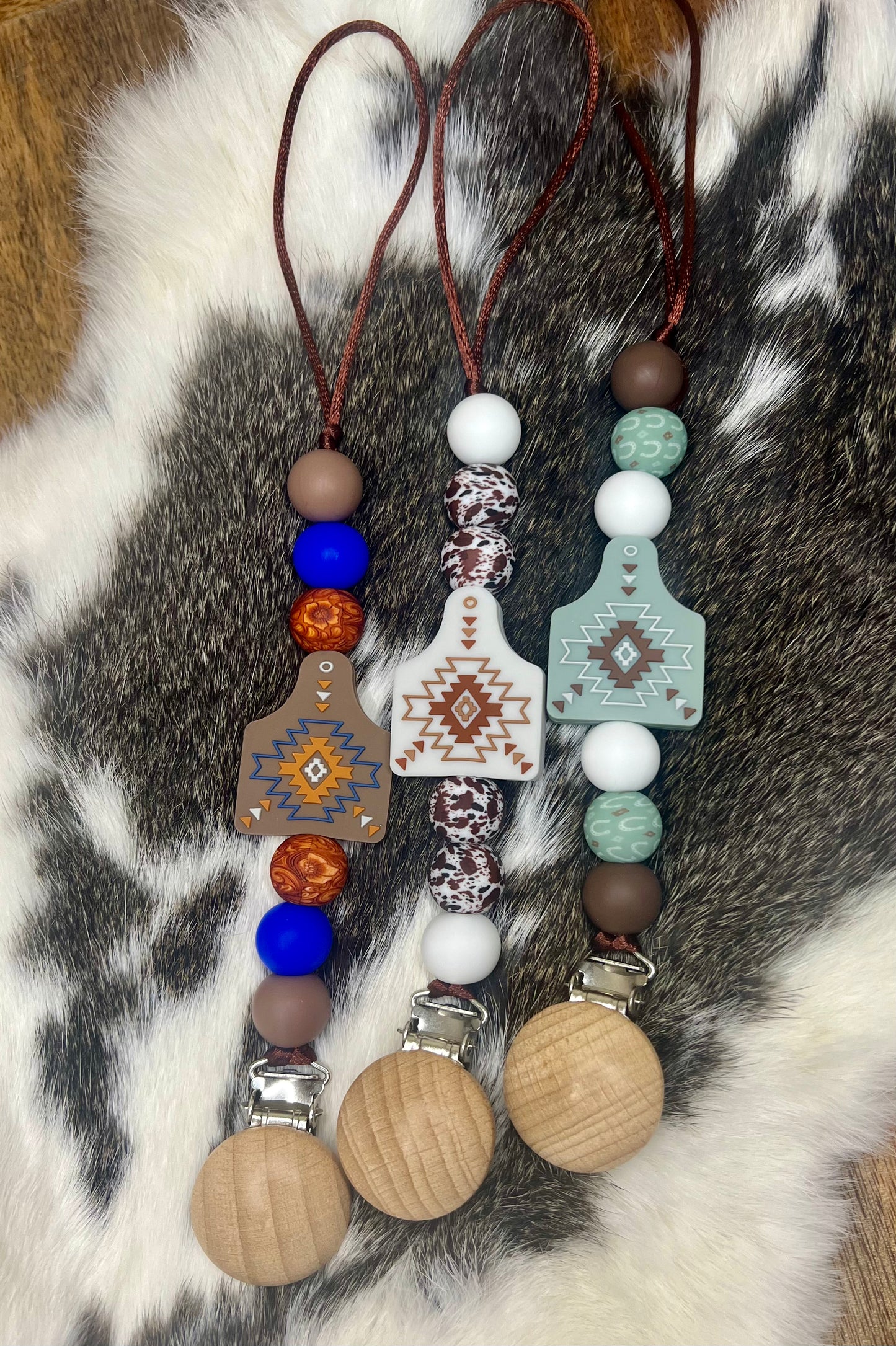 Brown Aztec cow tag pacifier clip