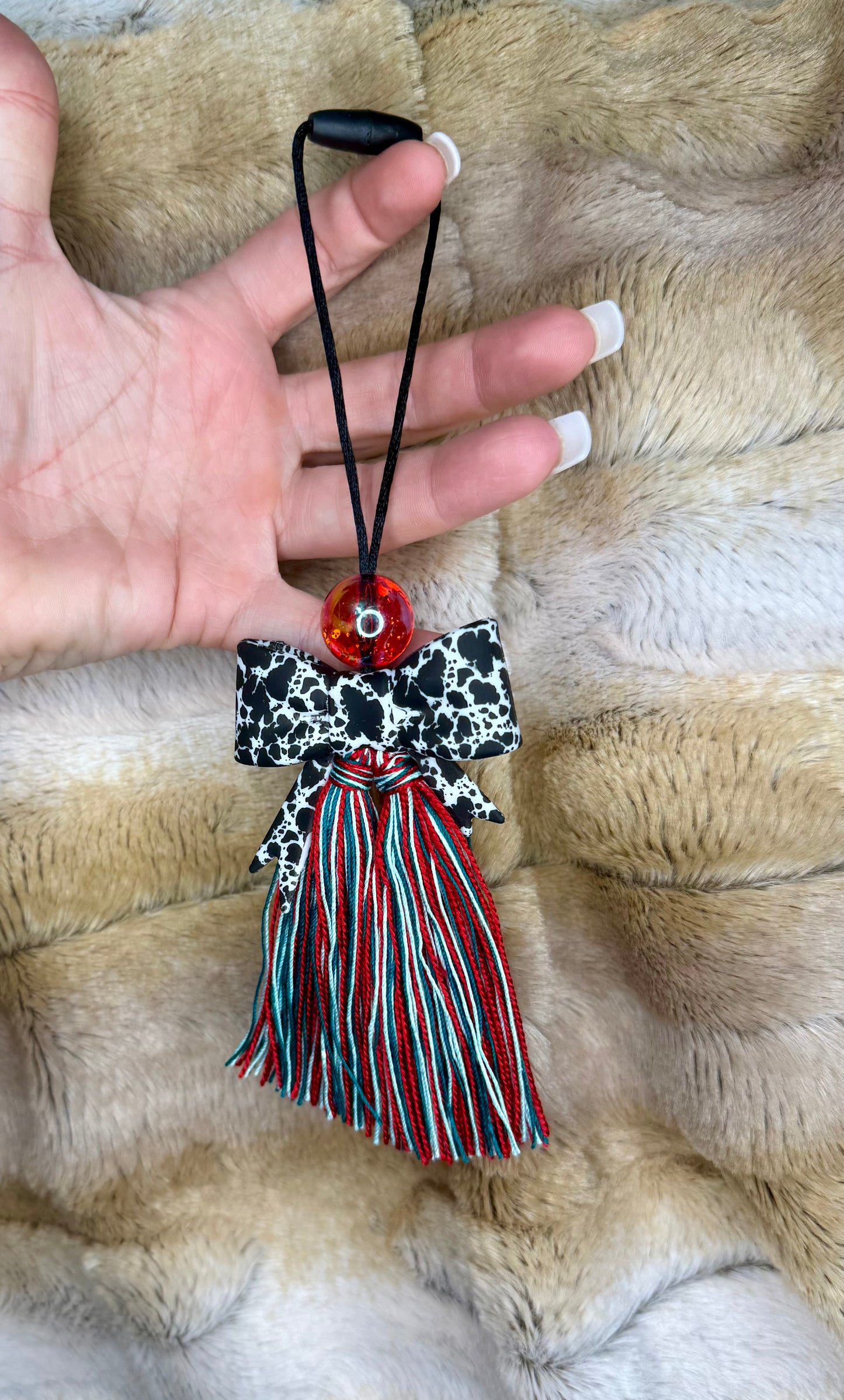 Punchy cowhide bow carcharm