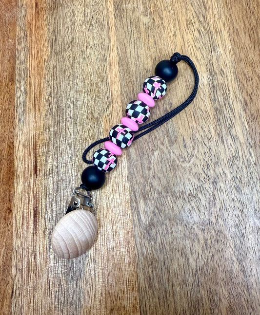Checkered pink crosses pacifier clip