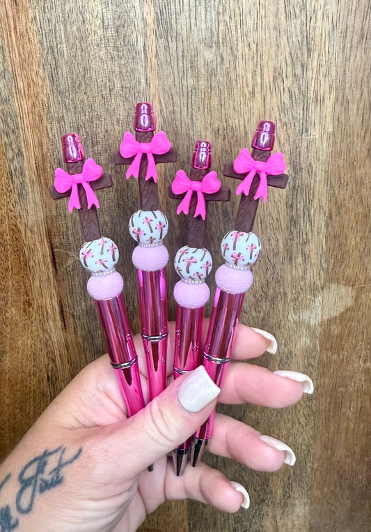 Pink bow on the cross pen