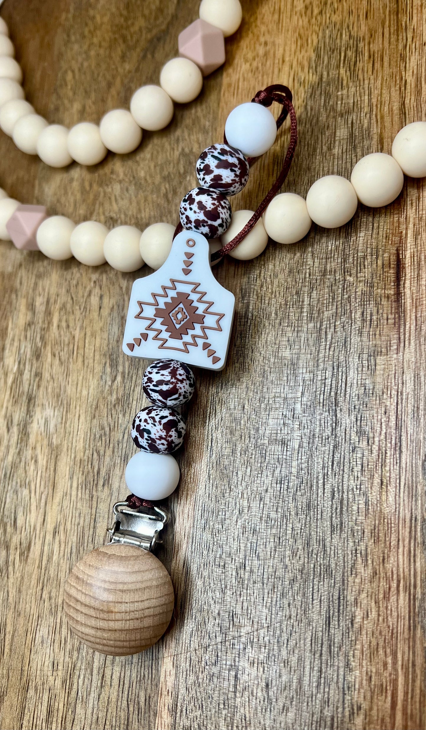 White Aztec cow tag pacifier clip