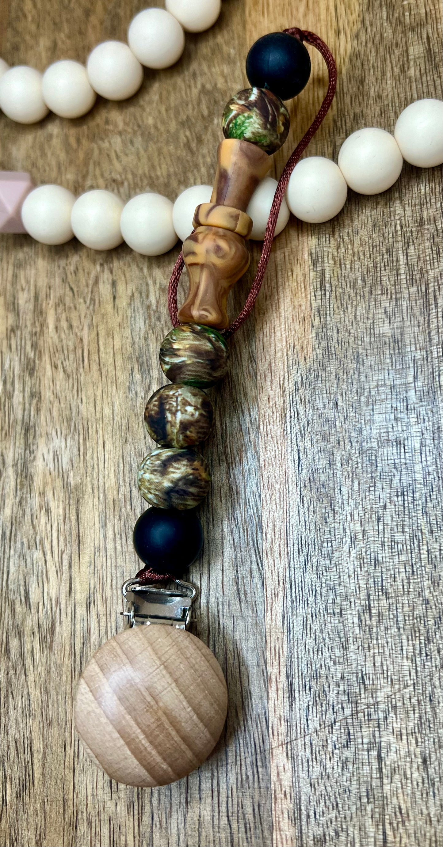 Duck call pacifier clip