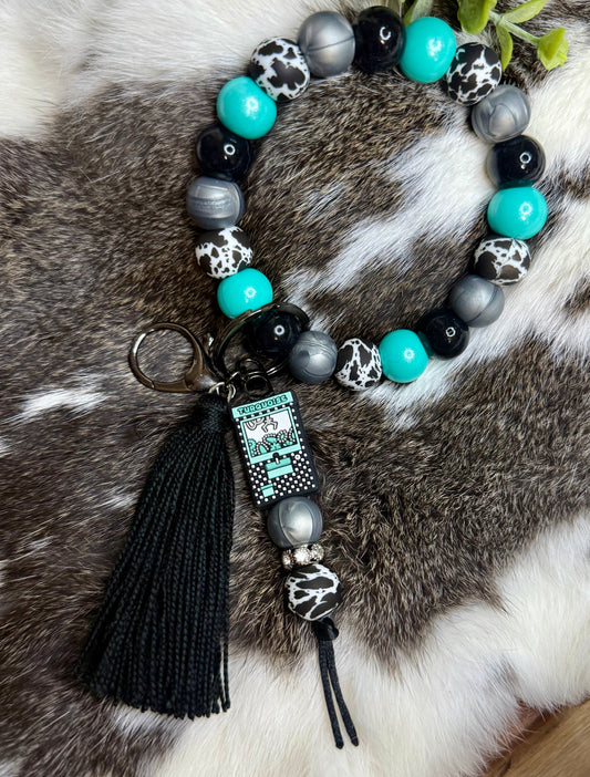 Turquoise cowhide wristlet